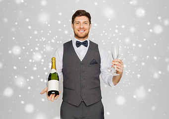 Image showing man with bottle of champagne and glasses at party