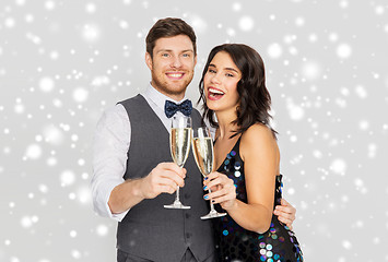 Image showing happy couple with champagne celebrating christmas