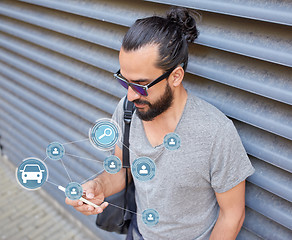 Image showing man using smartphone car sharing app on street