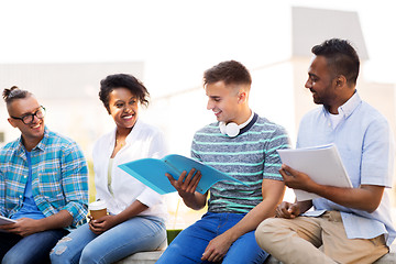 Image showing international students with notebooks outdoors