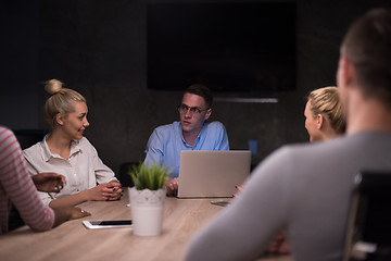 Image showing Multiethnic startup business team in night office