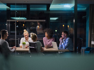 Image showing Multiethnic startup business team in night office