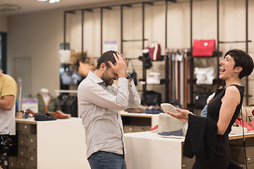 Image showing couple chooses shoes At Shoe Store