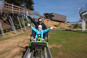 Image showing father and son enjoys driving on alpine coaster