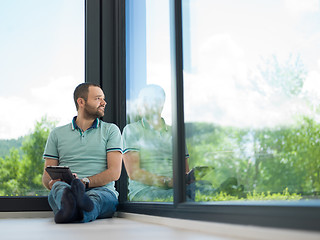 Image showing man on the floor enjoying relaxing lifestyle