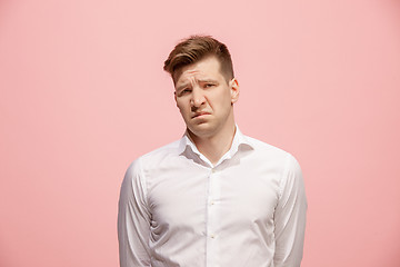 Image showing Beautiful bored man isolated on pink background