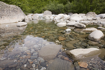 Image showing Clearwater stream over mixed rocks