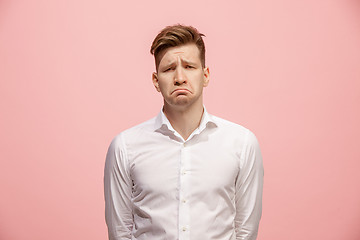 Image showing Beautiful bored man isolated on pink background