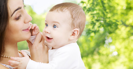 Image showing mother with baby over green natural background