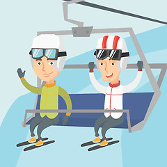 Image showing Two happy skiers using cableway at ski resort.