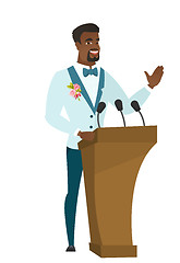 Image showing African groom giving a speech from tribune.