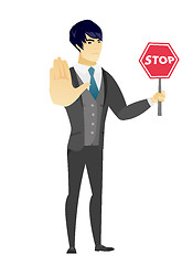 Image showing Asian groom holding stop road sign.