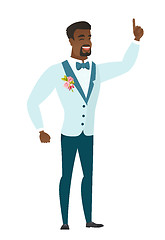 Image showing African groom pointing with his forefinger.