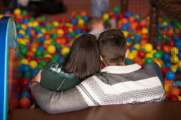 Image showing young parents with kids in a children\'s playroom