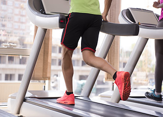 Image showing people exercisinng a cardio on treadmill in gym