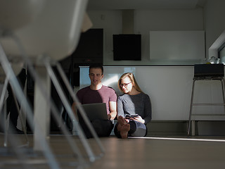 Image showing couple using tablet and laptop computers