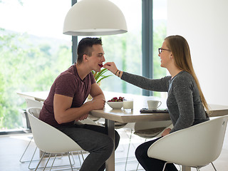 Image showing couple enjoying morning coffee and strawberries