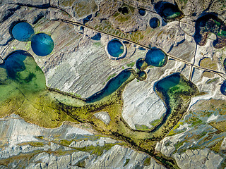 Image showing Rock pools on exposed coastal rock shelf platform