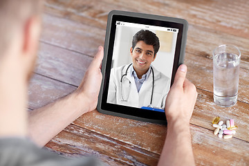 Image showing patient having video chat with doctor on tablet pc