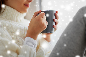 Image showing close up of girl in winter sweater with cacao mug