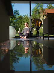 Image showing young woman doing morning yoga exercises