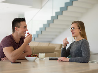 Image showing couple enjoying morning coffee and strawberries