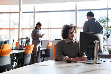 Image showing businessman working using a computer in startup office