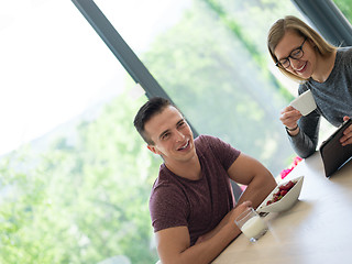 Image showing couple enjoying morning coffee and strawberries