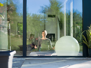 Image showing young woman doing morning yoga exercises