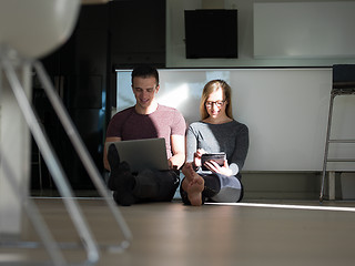 Image showing couple using tablet and laptop computers