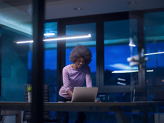 Image showing black businesswoman using a laptop in startup office