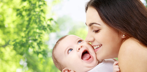 Image showing mother with baby over green natural background