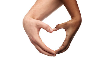 Image showing hands of different skin color making heart shape