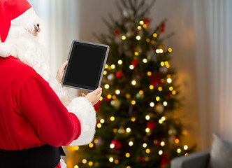 Image showing santa claus with tablet pc over christmas tree