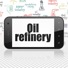 Image showing Manufacuring concept: Smartphone with Oil Refinery on display