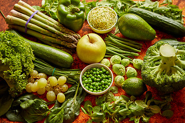 Image showing Fresh green vegetables and fruits assortment placed on a rusty metal