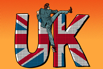 Image showing businessman overcomes the border. UK word flag