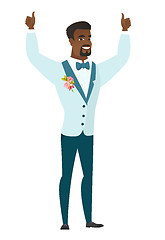 Image showing Groom standing with raised arms up.