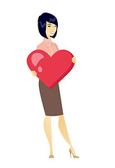 Image showing Asian business woman holding a big red heart.