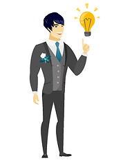 Image showing Groom pointing at business idea light bulb.