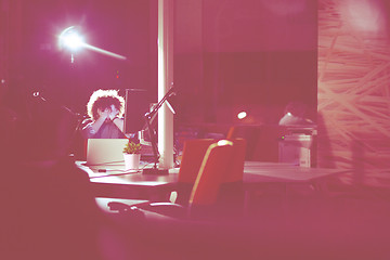 Image showing businessman relaxing at the desk