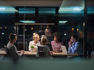 Image showing Multiethnic startup business team in night office