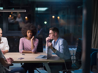 Image showing Multiethnic startup business team in night office