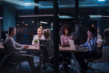 Image showing Multiethnic startup business team in night office