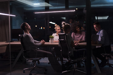 Image showing Multiethnic startup business team in night office