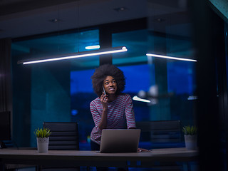 Image showing black businesswoman using a laptop in startup office