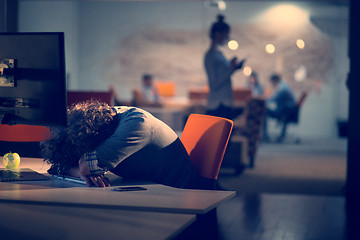 Image showing businessman relaxing at the desk