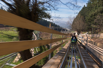 Image showing father and son enjoys driving on alpine coaster