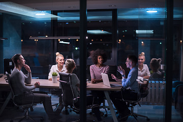 Image showing Multiethnic startup business team in night office