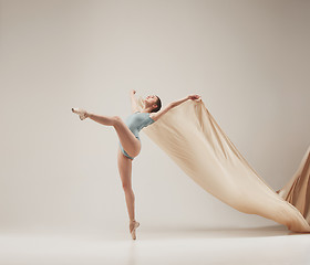 Image showing Modern ballet dancer dancing in full body on white studio background.